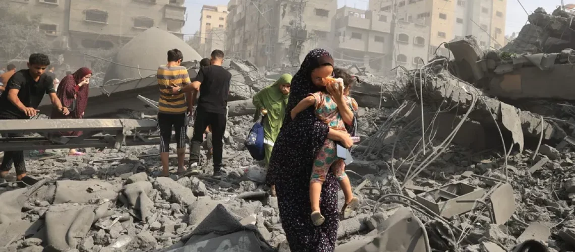 104617979-topshot-palestinians-evacuate-the-area-following-an-israeli-airstrike-on-the-sousi-m